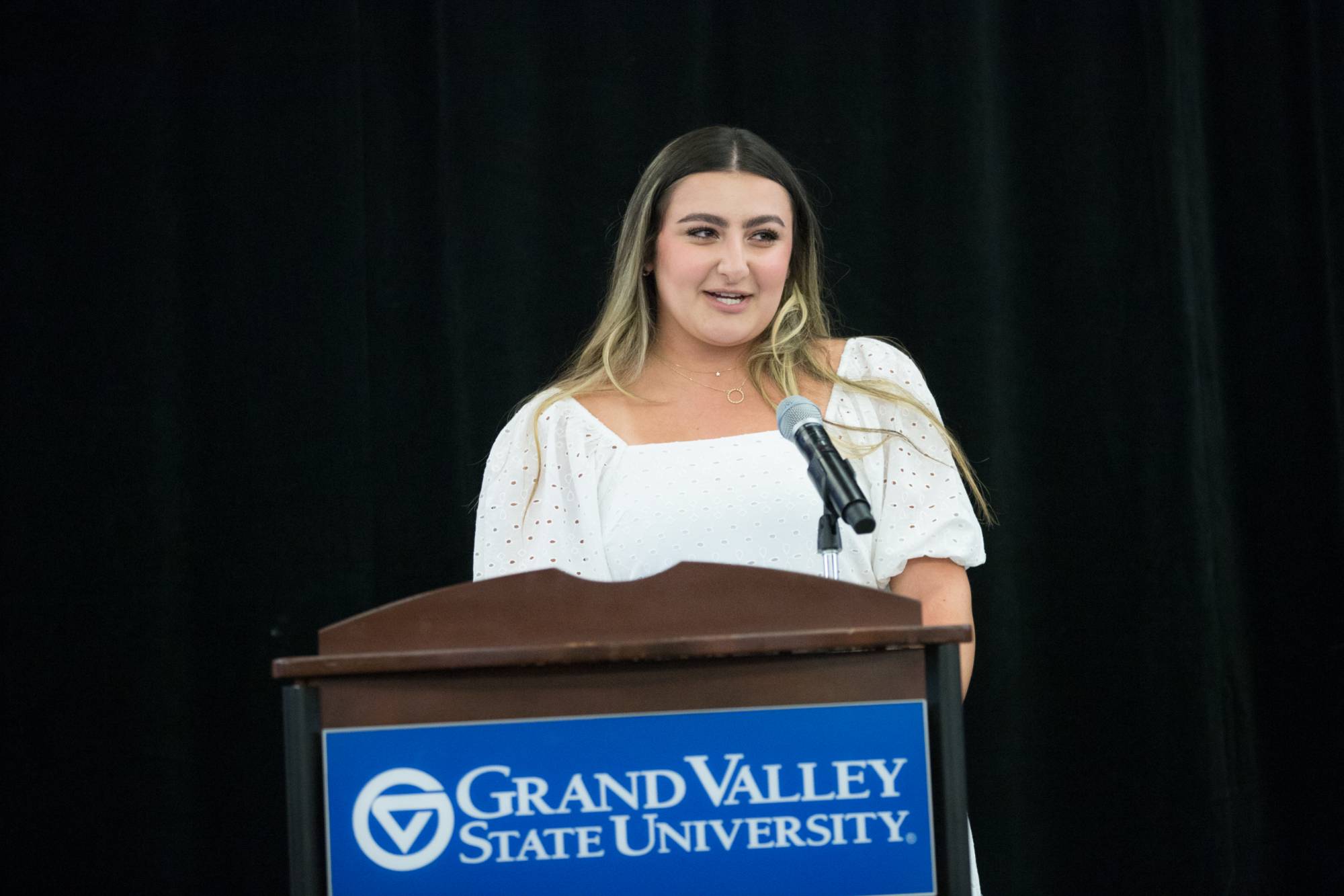 Honors graduate delivering speech to fellow graduates